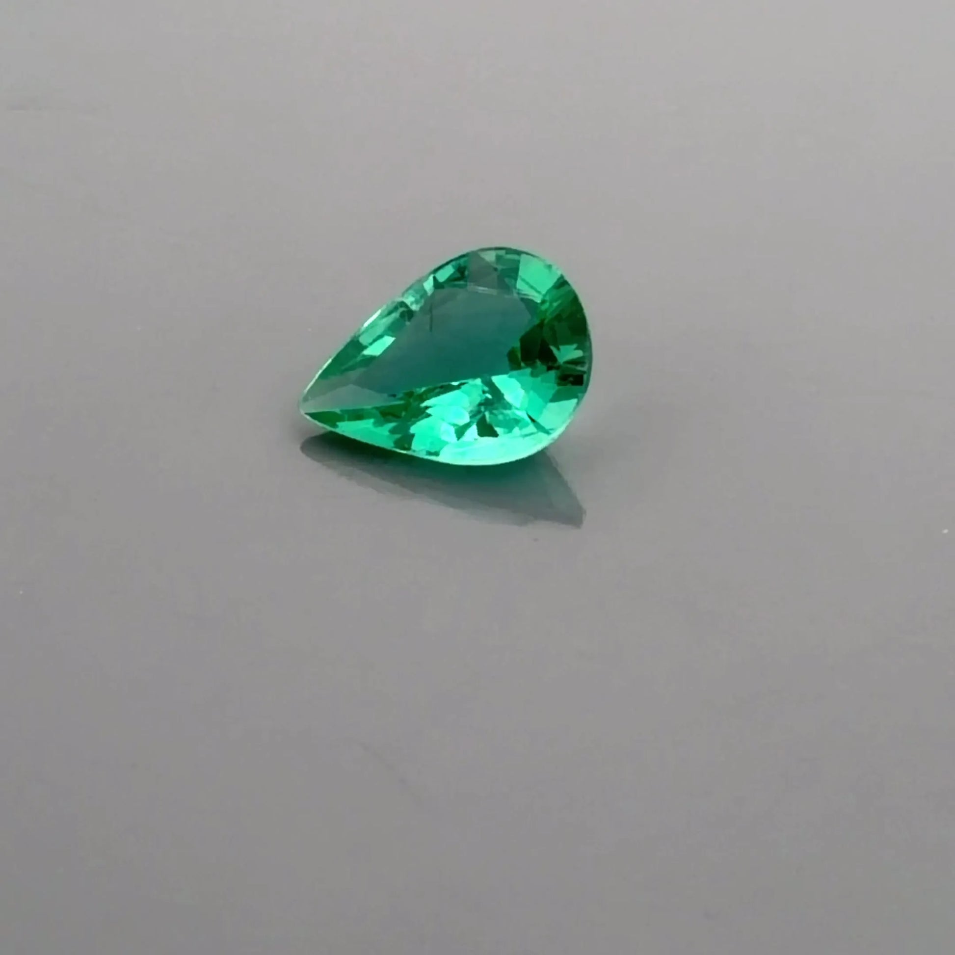 0.64ct Pear Natural Emerald (Colour Green, Clarity Slightly Included, Cut Faceted)